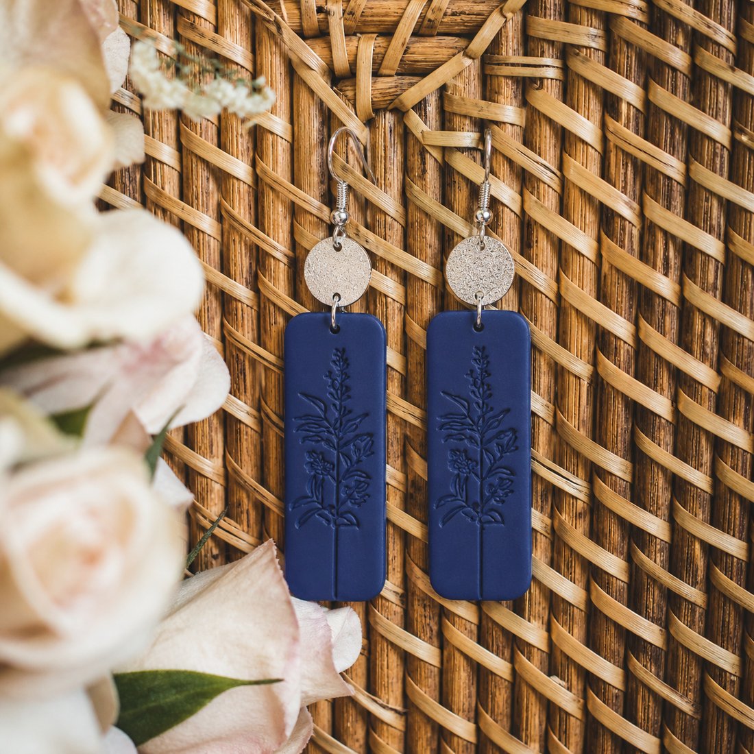 Handcrafted floral earrings featuring delicate blue and silver tones