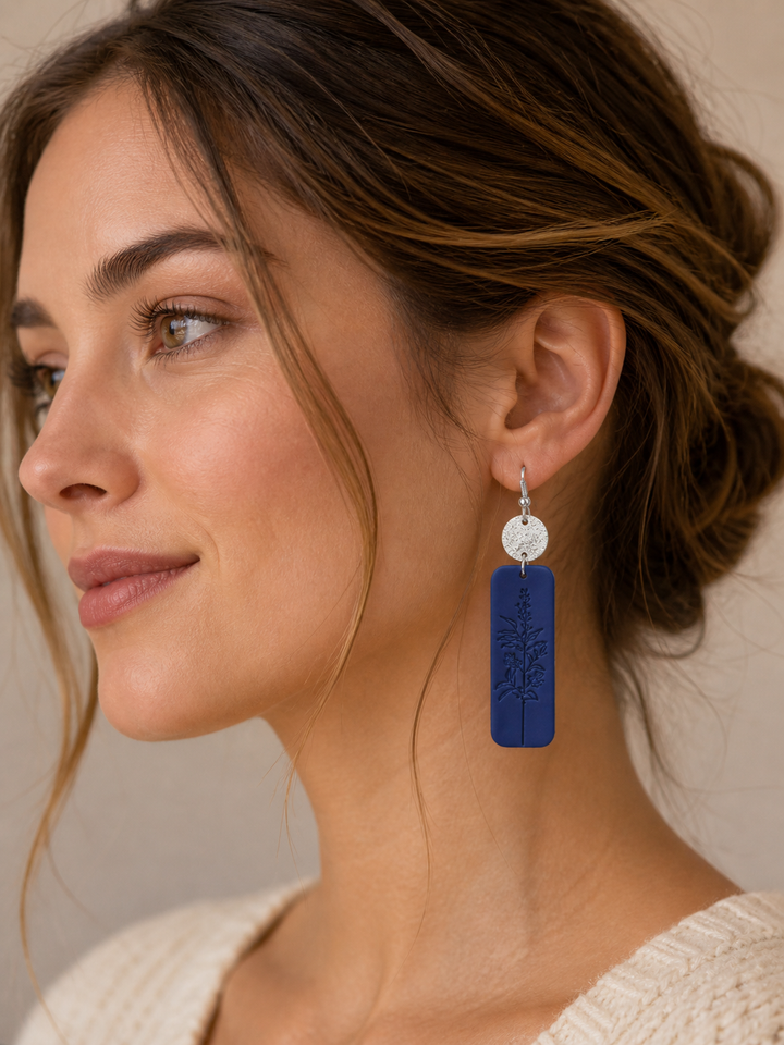 Handcrafted floral earrings featuring delicate blue and silver tones