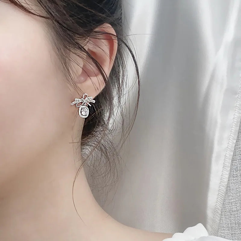 Moissanite Bow Stud and Drop Earrings in Sterling Silver